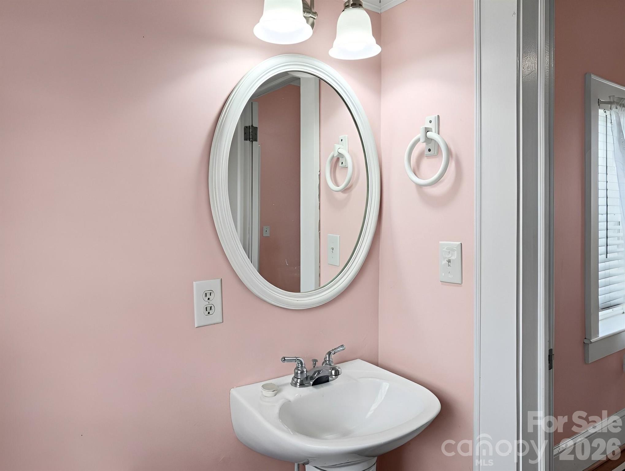 901 Mill Street Albemarle, NC 28001 - Photo 21 of 27 a bathroom with a sink and a mirror