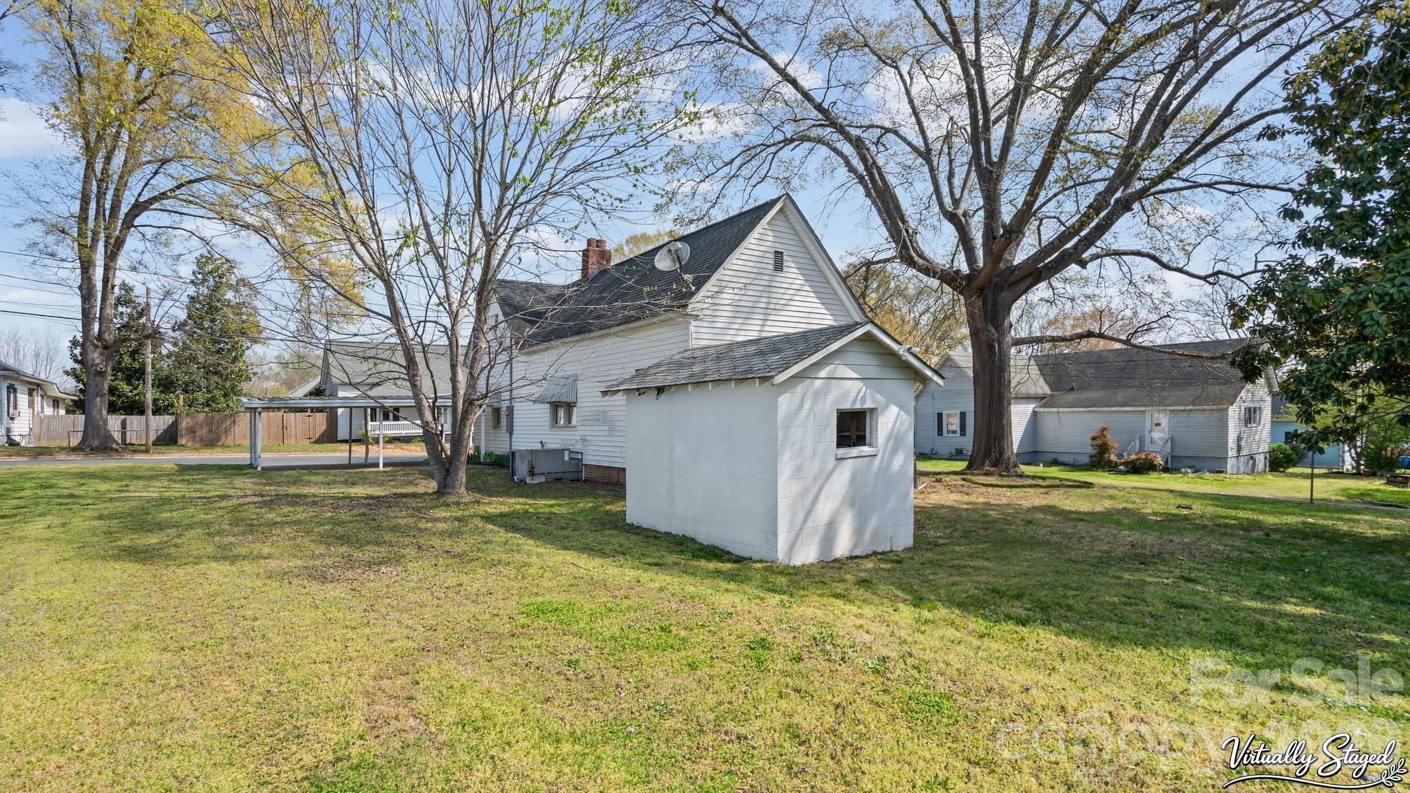 901 Mill Street Albemarle, NC 28001 - Photo 23 of 27 a view of a house with a yard