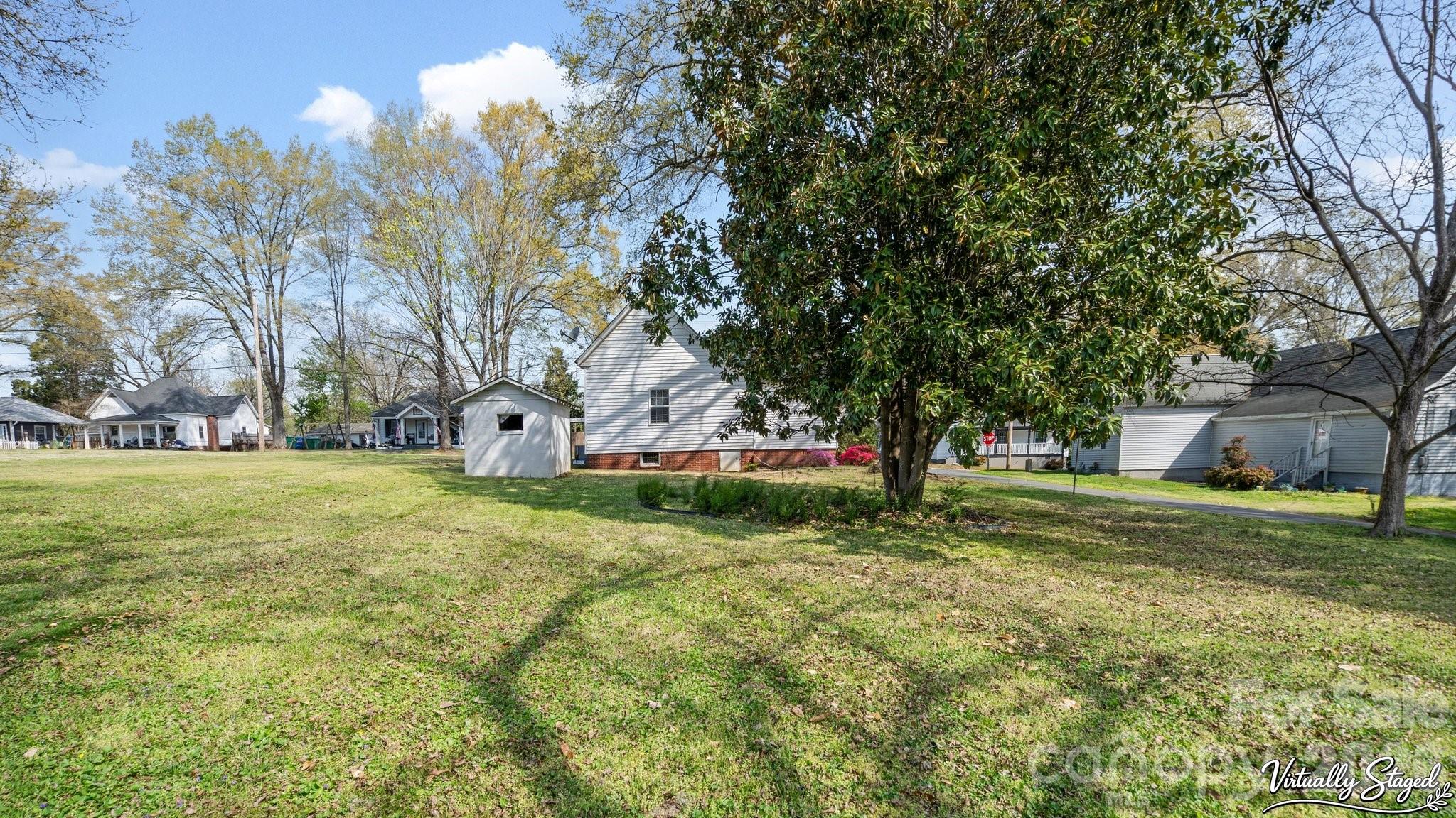 901 Mill Street Albemarle, NC 28001 - Photo 24 of 27 a garden view with large trees