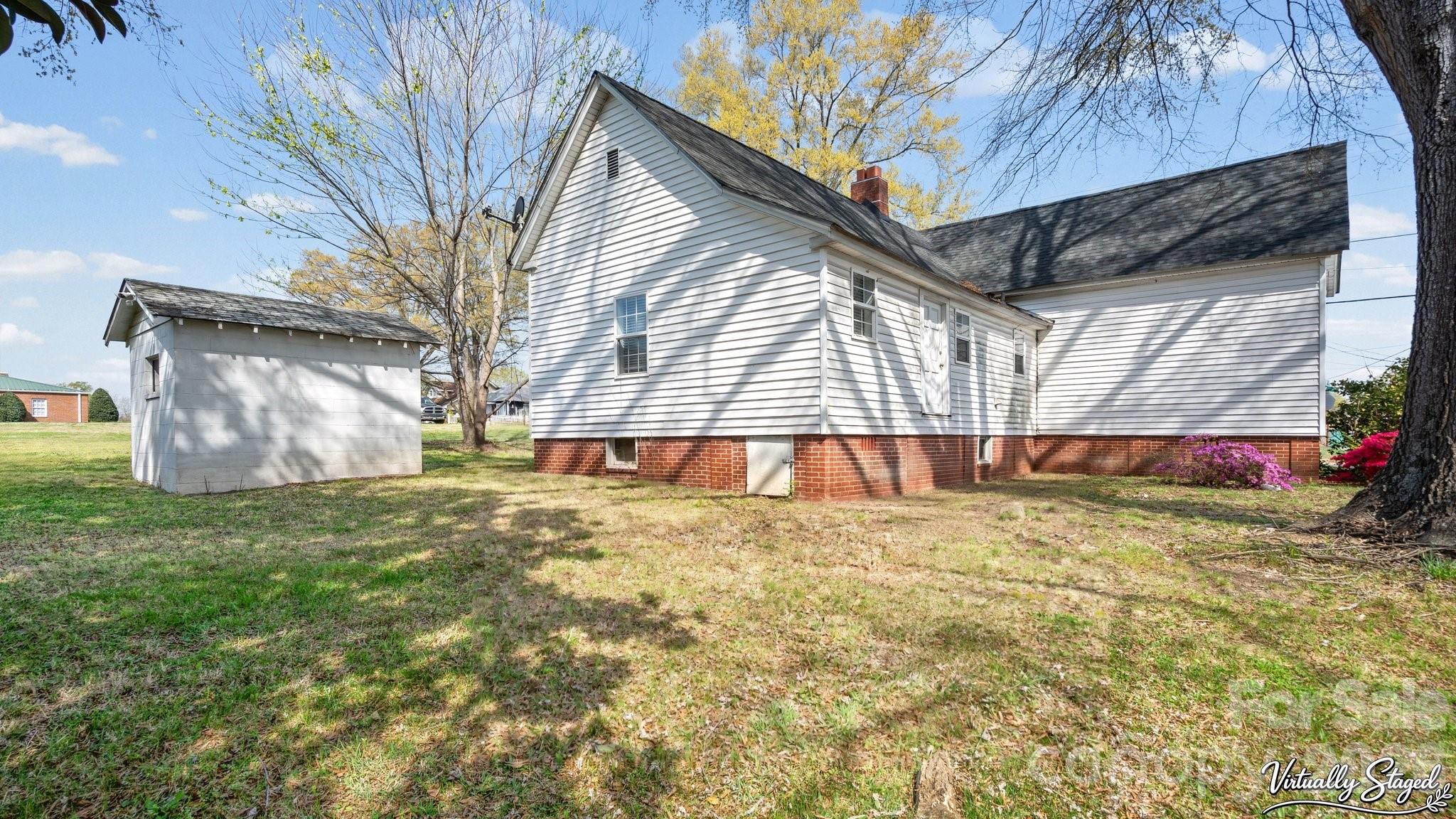 901 Mill Street Albemarle, NC 28001 - Photo 25 of 27 a view of a backyard with a tree