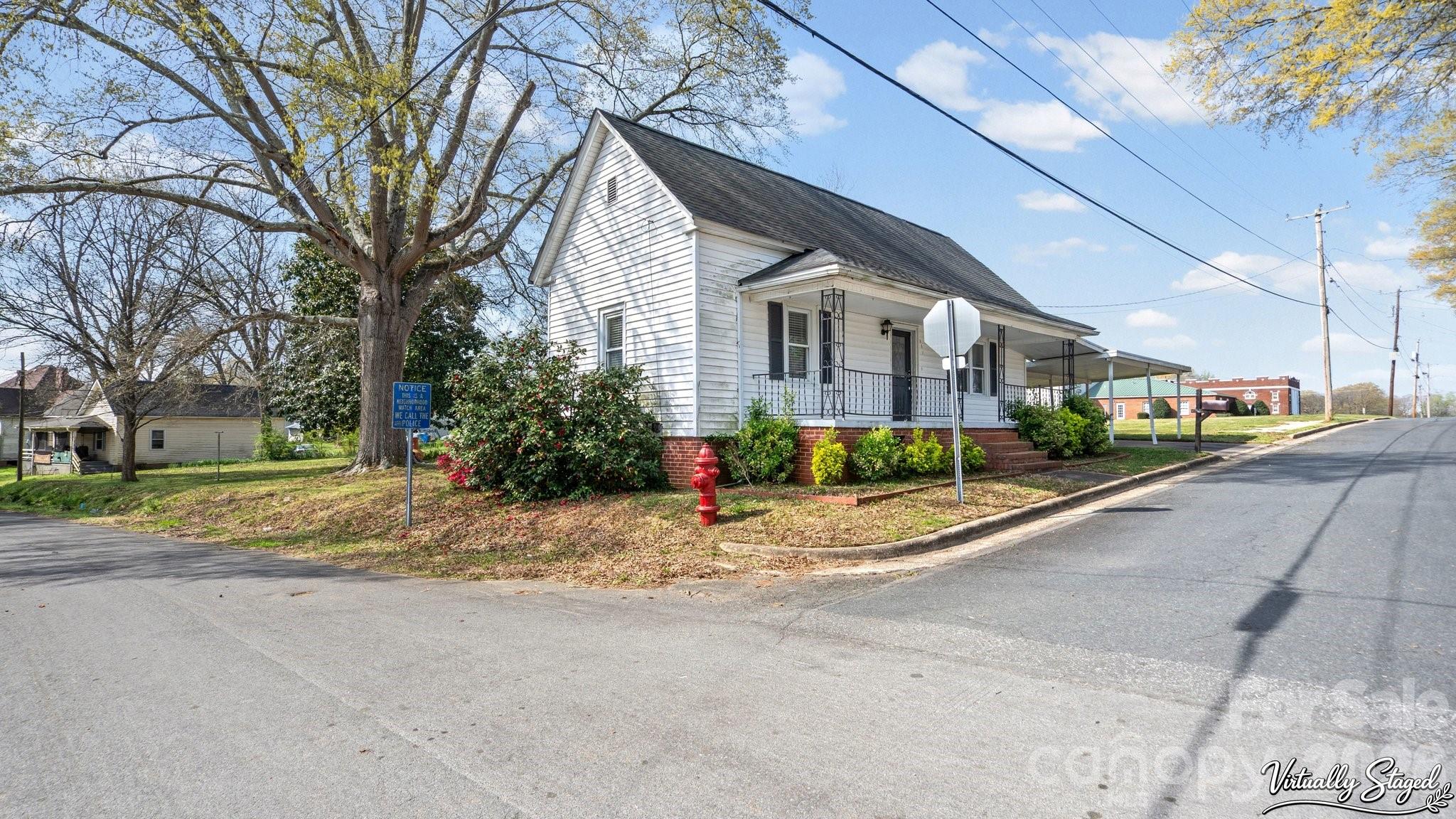 901 Mill Street Albemarle, NC 28001 - Photo 3 of 27 a view of a street with a house