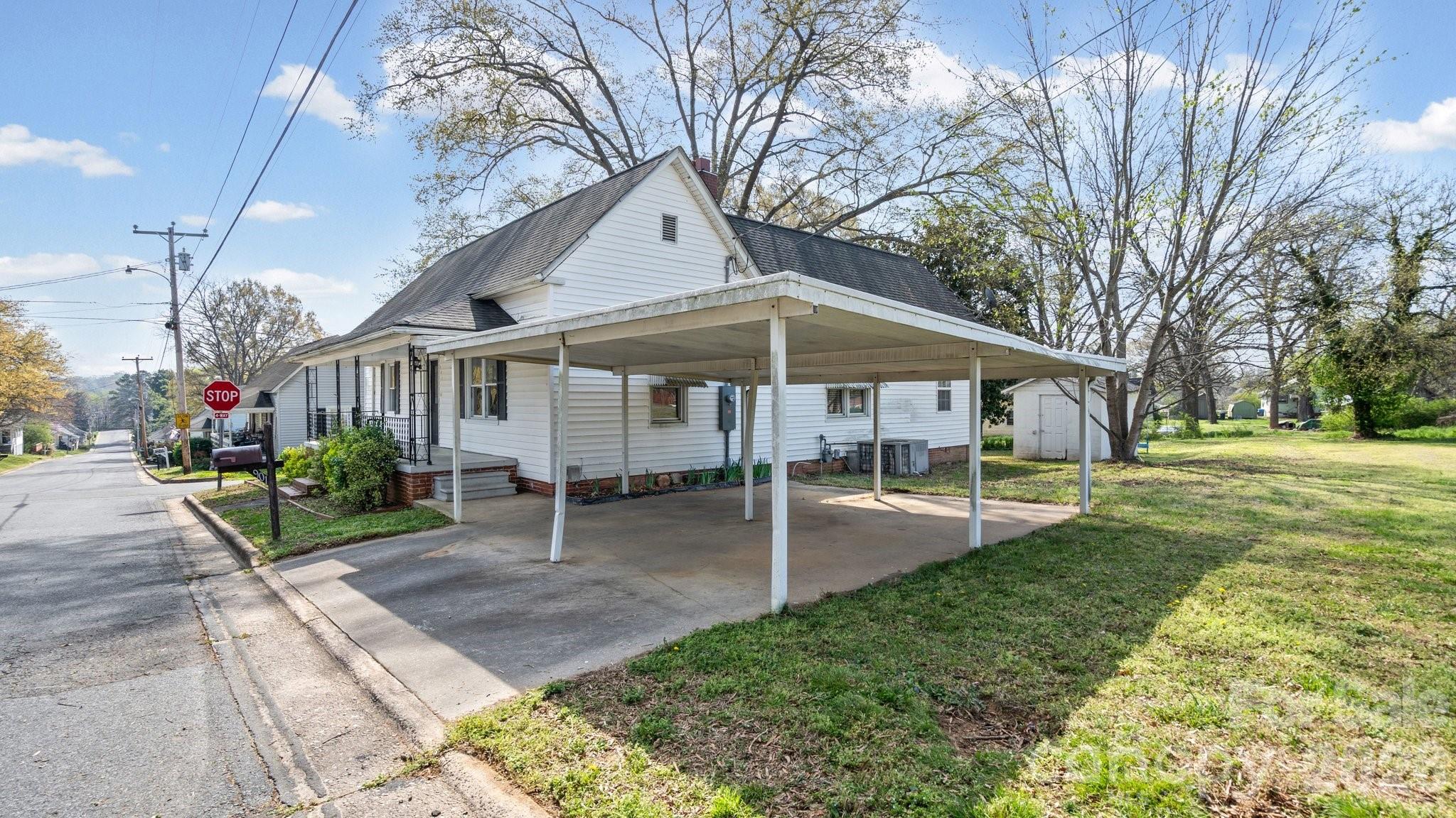 901 Mill Street Albemarle, NC 28001 - Photo 5 of 27 a view of a house with a yard porch and sitting area