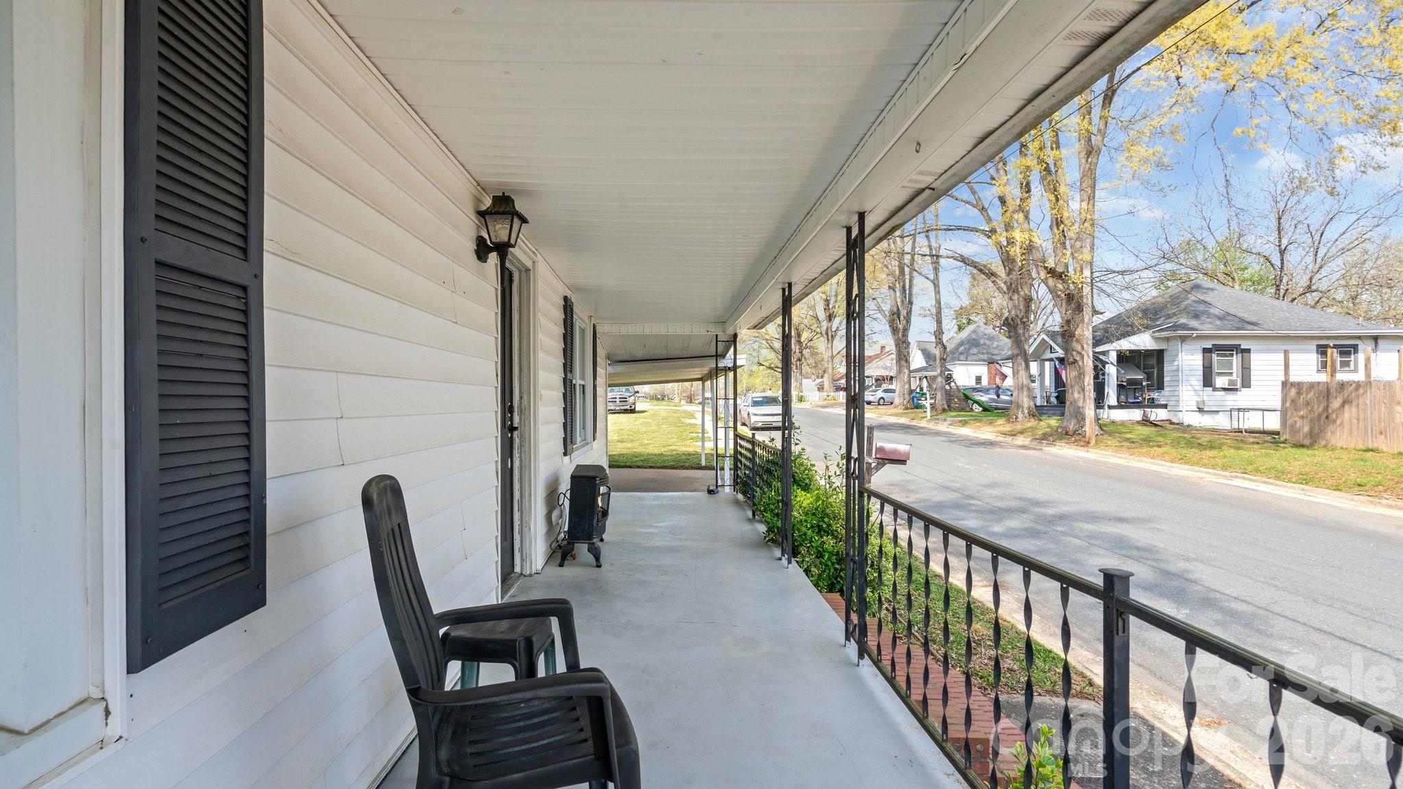 901 Mill Street Albemarle, NC 28001 - Photo 6 of 27 a view of an chair and tables in the balcony