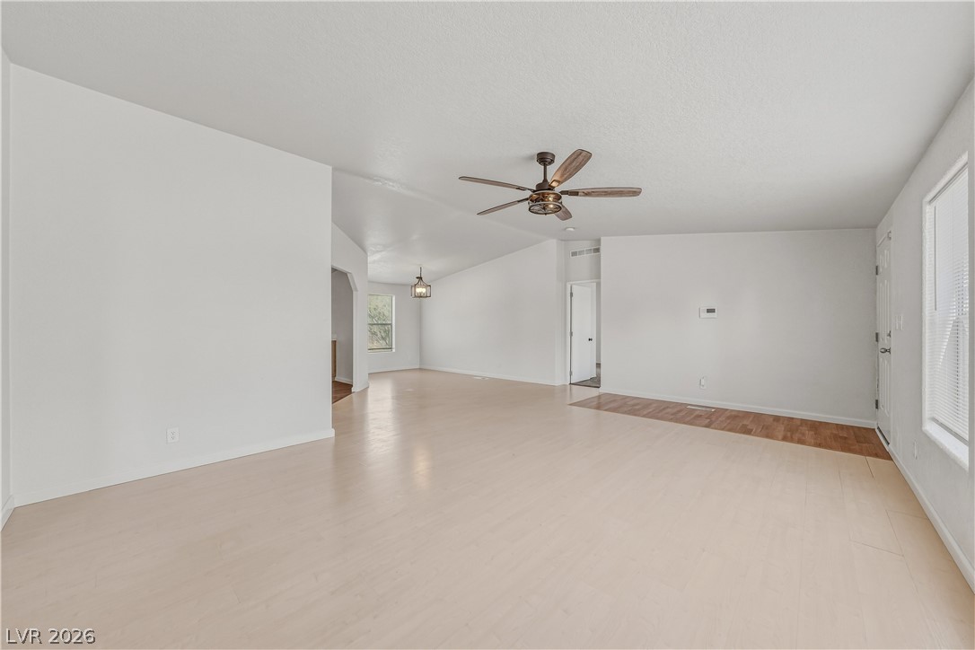 1890 West Dyer Road Pahrump, NV 89048 - Photo 16 of 40 This airy living area features light flooring and an elegant ceiling fan.