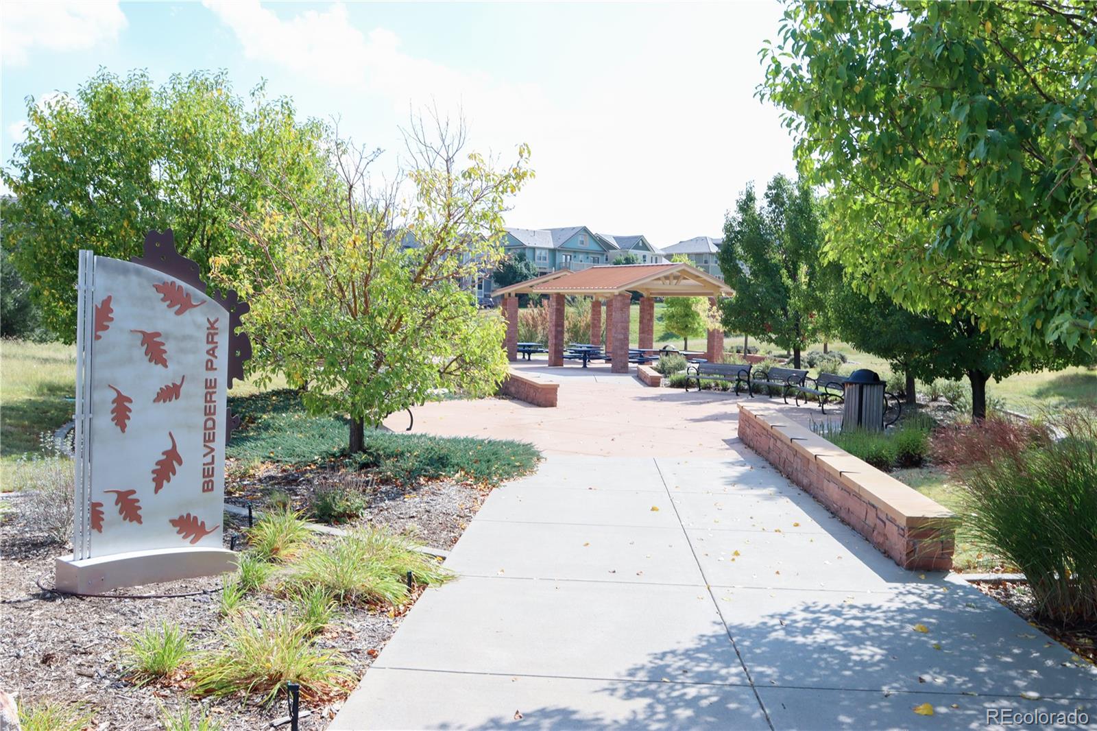 9242 Ridgegate Parkway Lone Tree, CO 80124 - Photo 27 of 28 a view of a building with a garden and pathway