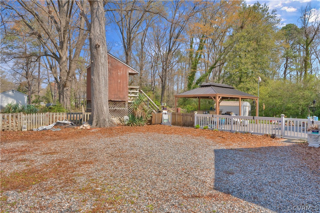5218 Jahnke Road Richmond, VA 23225 - Photo 15 of 35 a front view of a house with a yard and garage