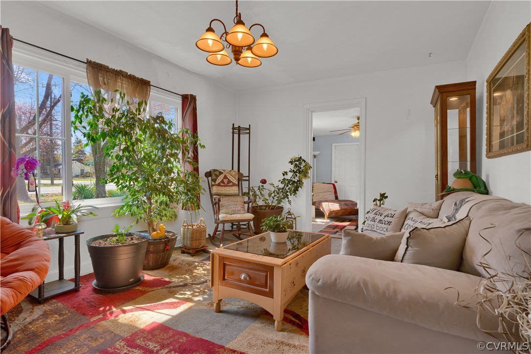 5218 Jahnke Road Richmond, VA 23225 - Photo 20 of 35 a living room with furniture potted plant and a large window