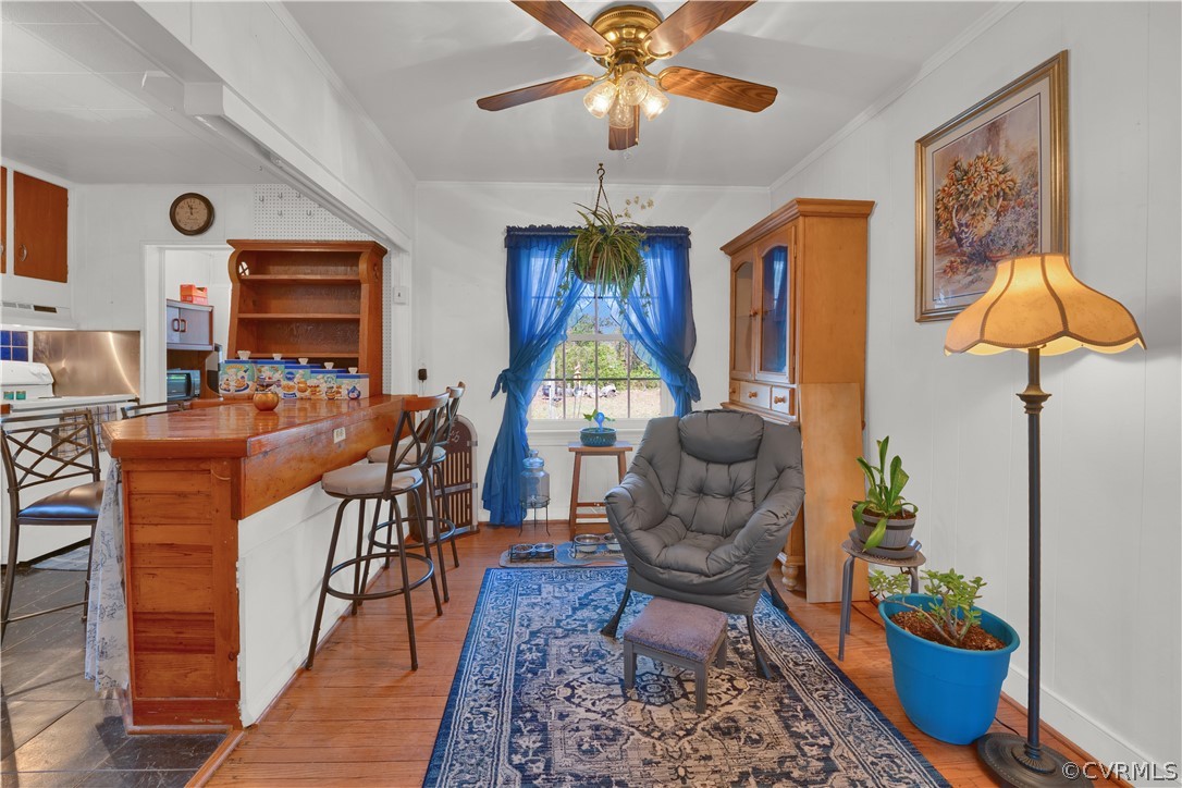 5218 Jahnke Road Richmond, VA 23225 - Photo 25 of 35 a living room with furniture a chandelier and a rug