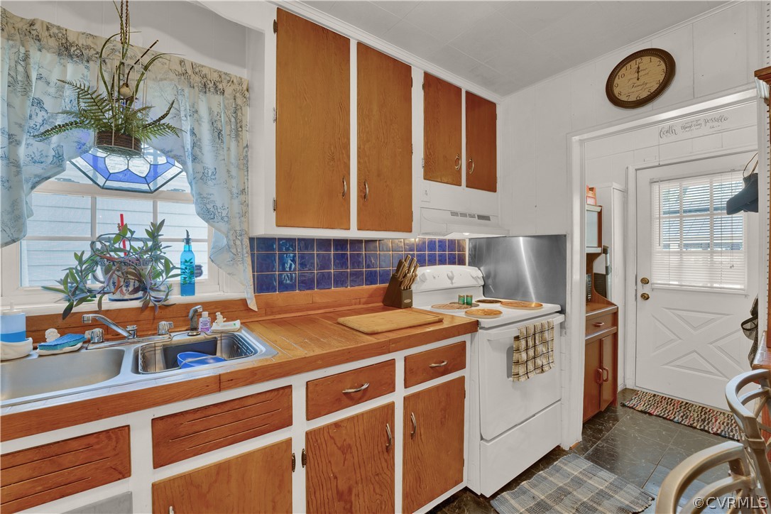 5218 Jahnke Road Richmond, VA 23225 - Photo 30 of 35 a view of a kitchen with a stove and a microwave