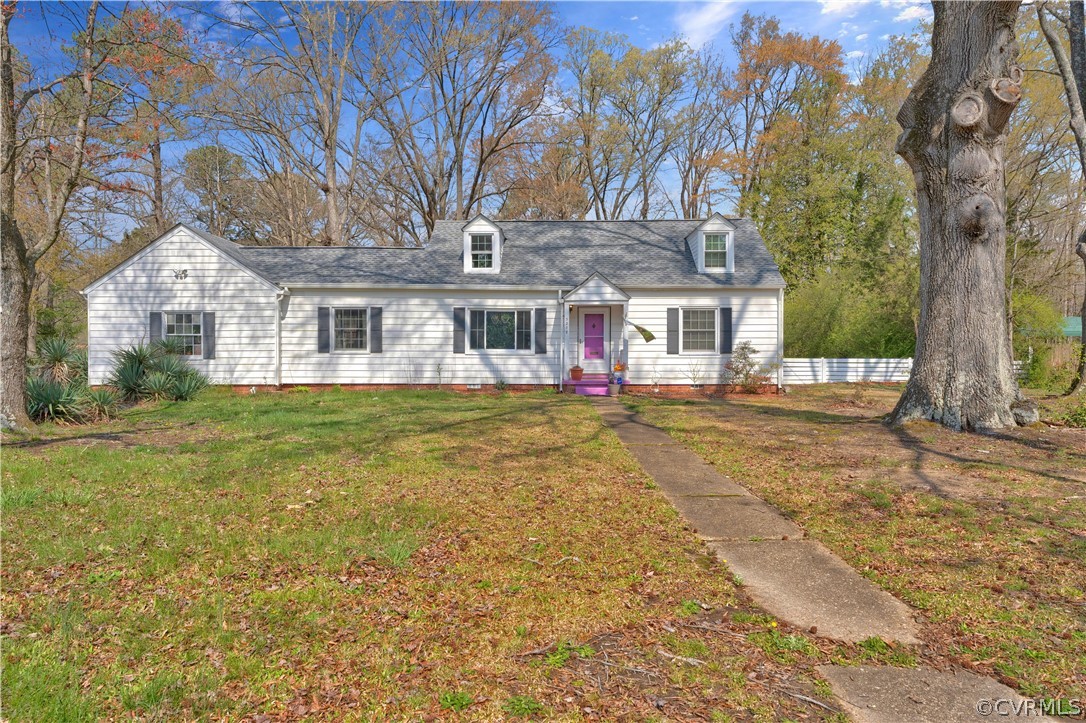 5218 Jahnke Road Richmond, VA 23225 - Photo 4 of 35 a front view of a house with a yard garage and trees