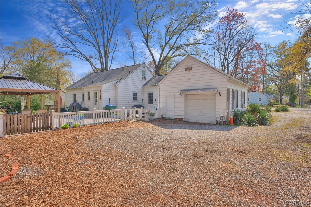 5218 Jahnke Road Richmond, VA 23225 - Photo 5 of 35 a white house with a large tree in front of it