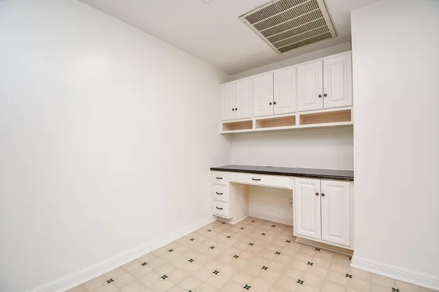 a bathroom with a sink a toilet and a window