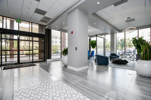 a view of a living room and a balcony