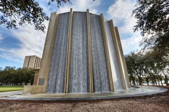 a view of a building with trees in the background