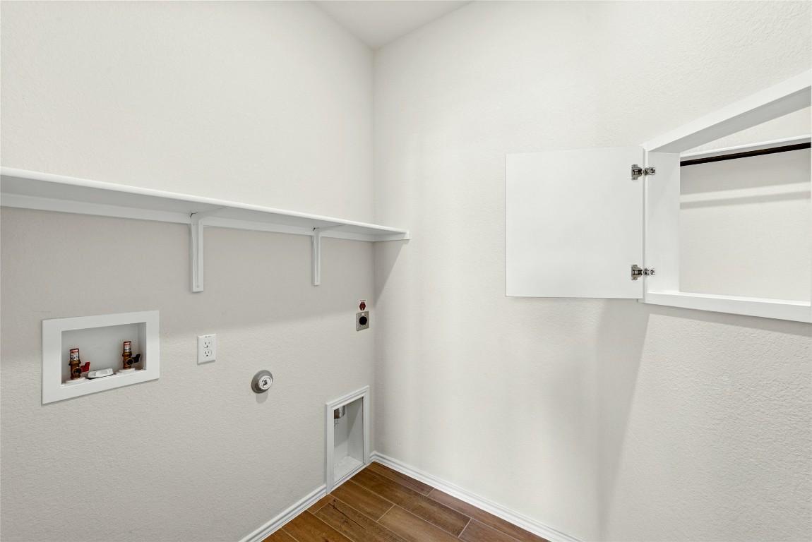 706 Livewater Cove Georgetown, TX 78633 - Photo 24 of 33 Laundry Room with Window from Main Bedroom Closet