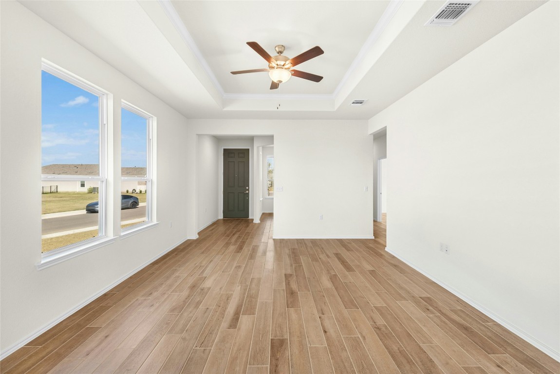 706 Livewater Cove Georgetown, TX 78633 - Photo 4 of 33 Wood-look hard tile throughout the home. No carpet!