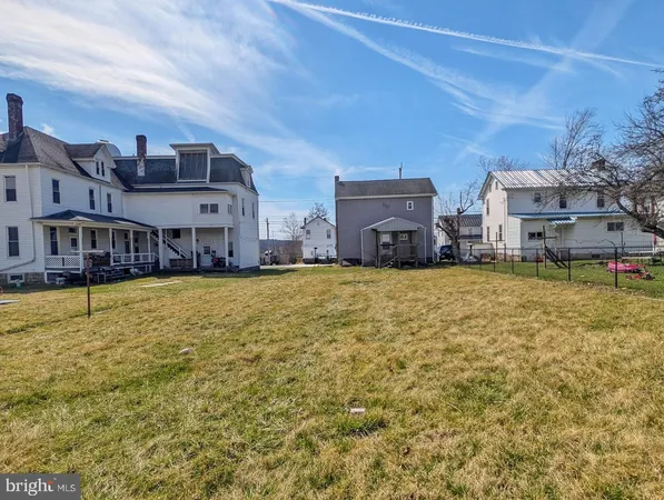 a room with pool table and glass door