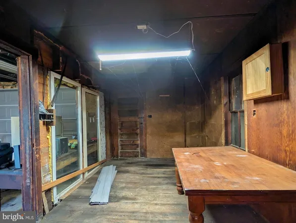 a view of a patio with table and chairs
