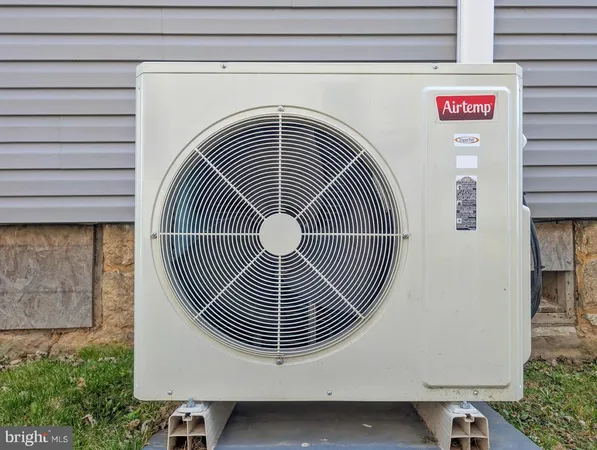 a balcony with chairs and wooden floor