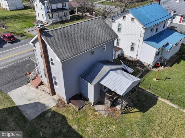 a view of swimming pool with outdoor seating and yard