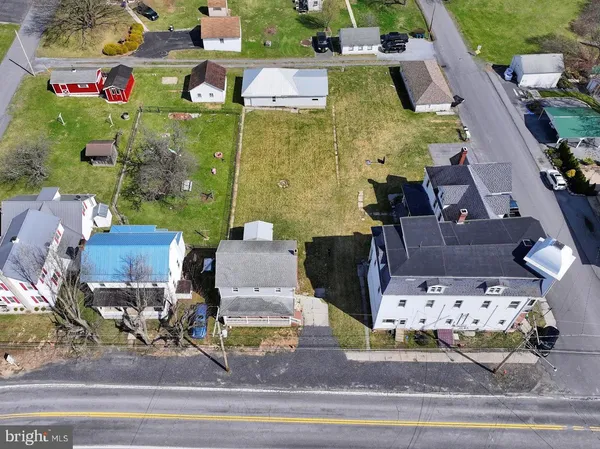 an aerial view of houses with outdoor space