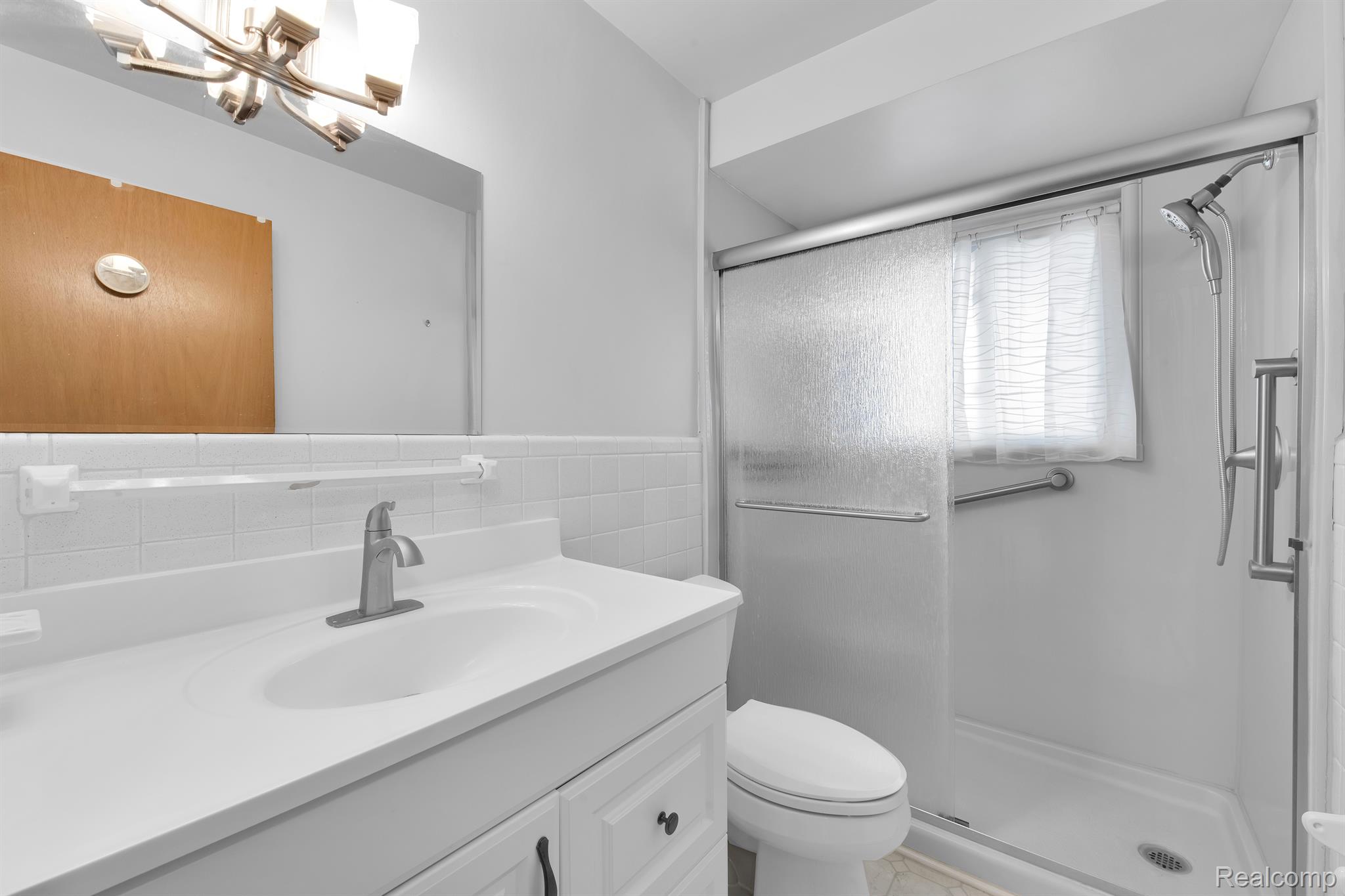 26945 Milford Road, Unit 2 New Hudson, MI 48165 - Photo 14 of 29 Updated bathroom.