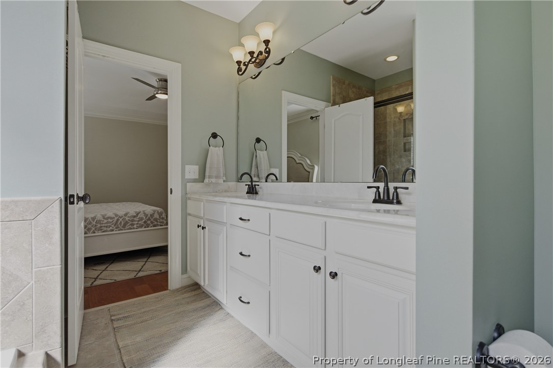 14 Spring Water Court Spring Lake, NC 28390 - Photo 11 of 34 a bathroom with a double vanity sink and mirror