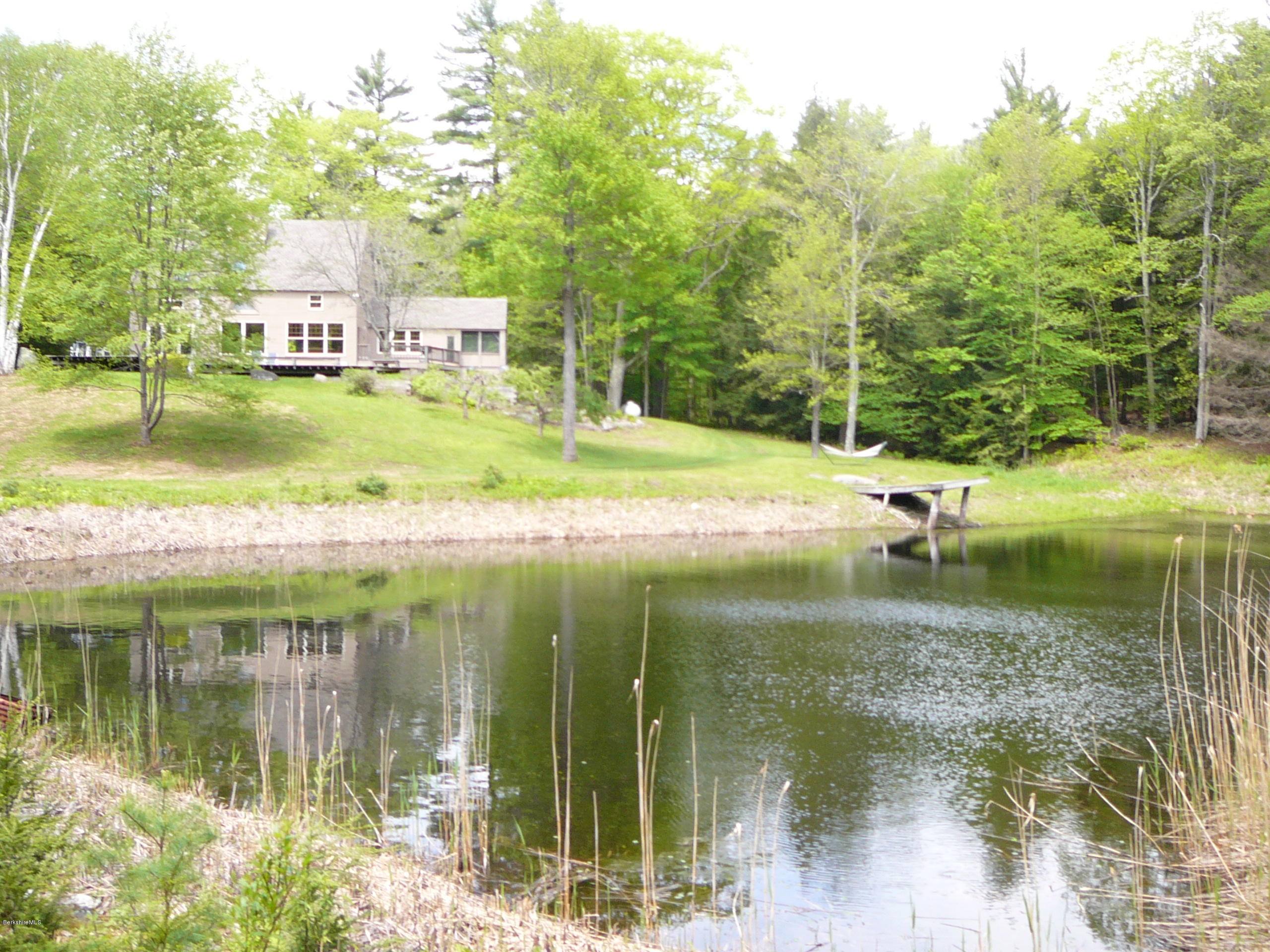 126 Tyringham Road Monterey, MA 01245 - Photo 12 of 35 a backyard of a house with lots of green space and fountain