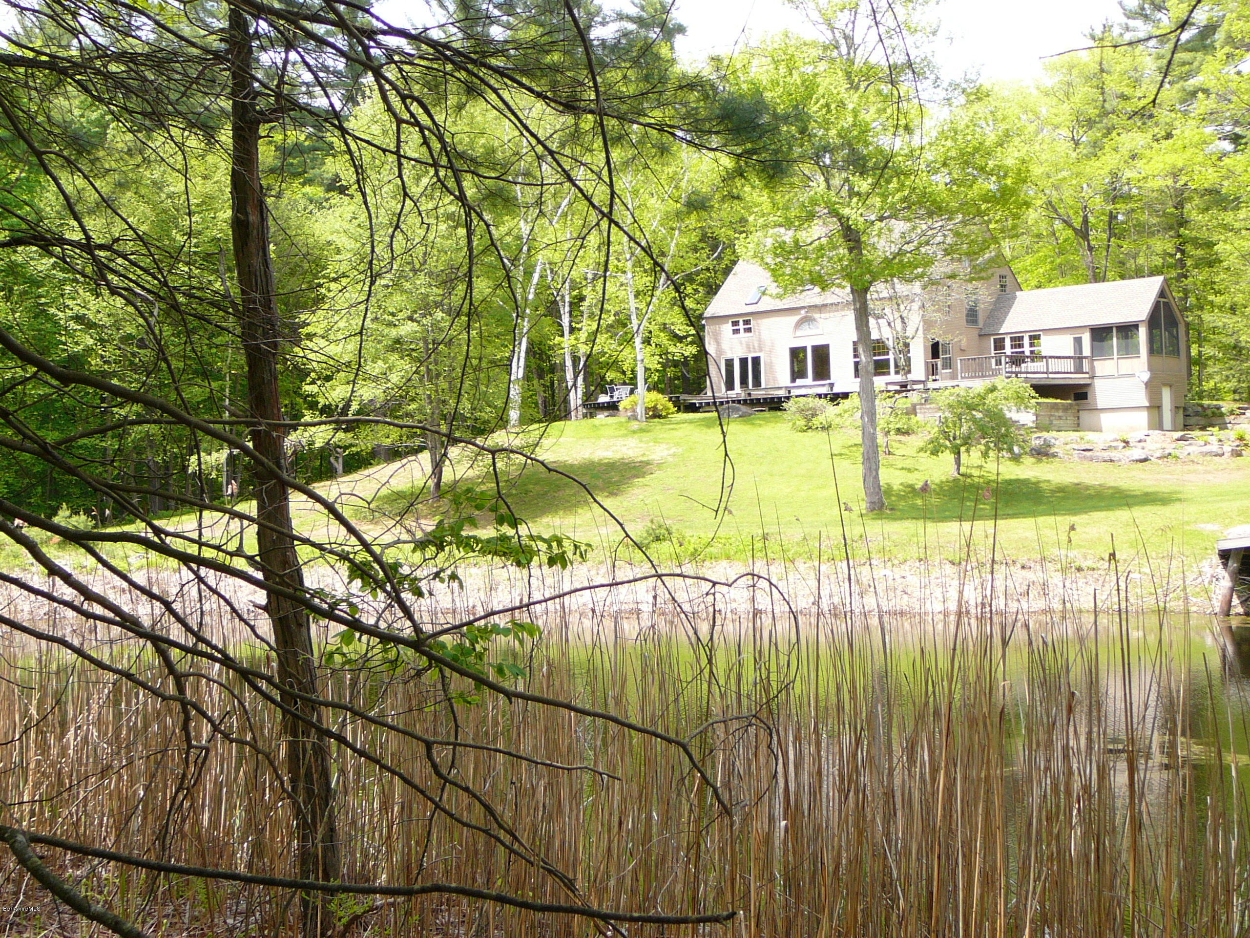126 Tyringham Road Monterey, MA 01245 - Photo 14 of 35 a view of a swimming pool with a patio