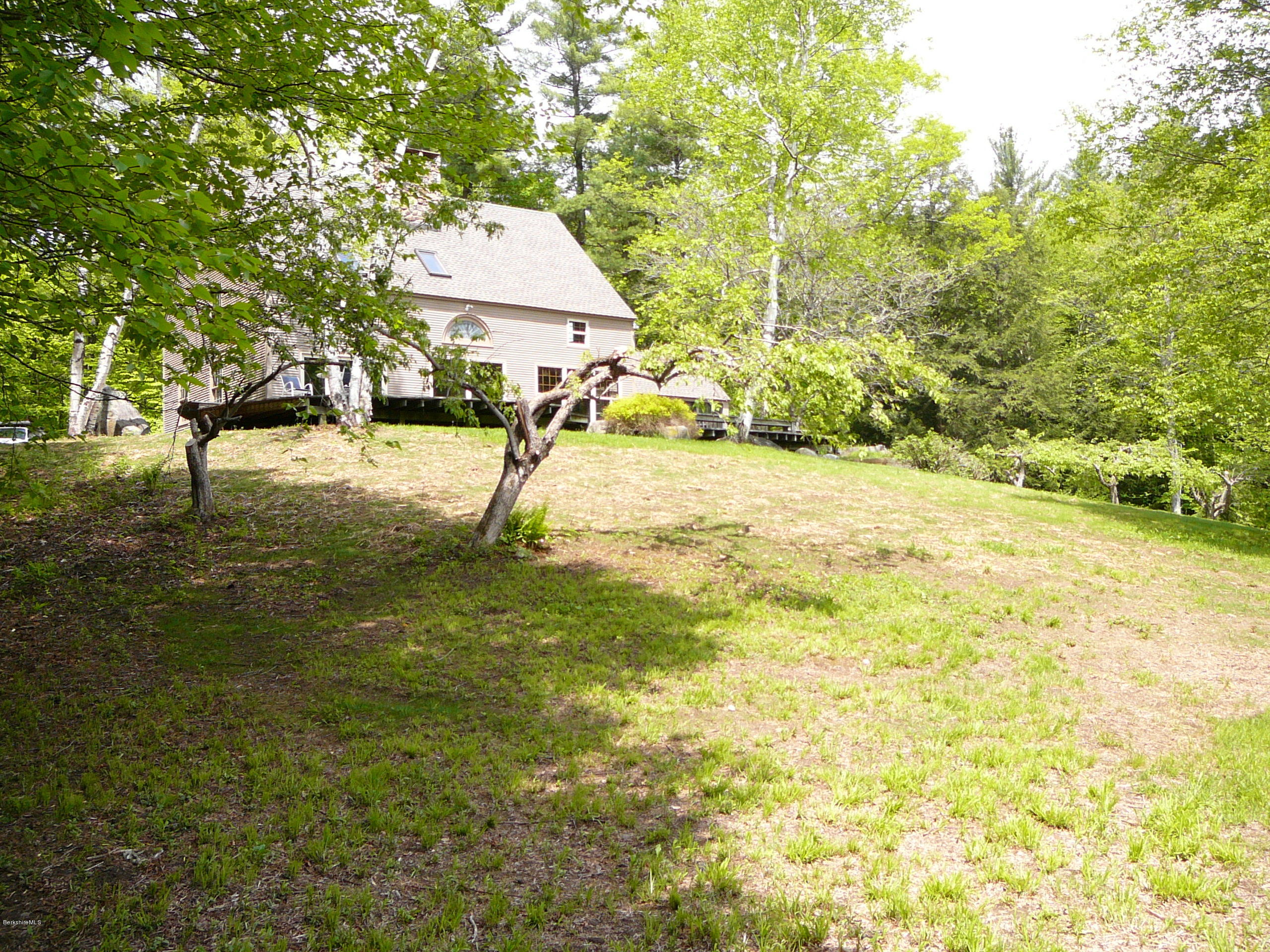 126 Tyringham Road Monterey, MA 01245 - Photo 17 of 35 a swimming pool with some trees in the background