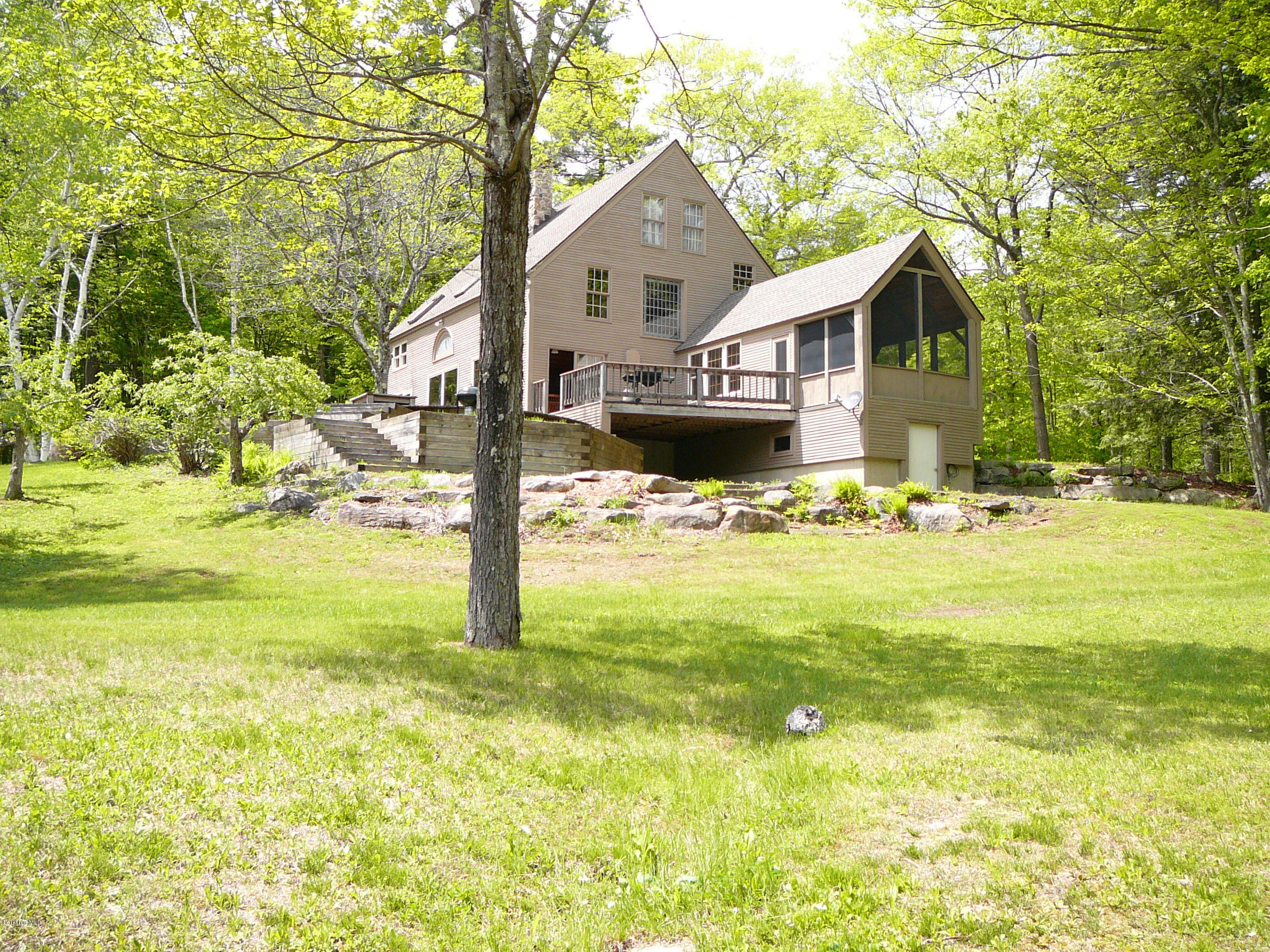 126 Tyringham Road Monterey, MA 01245 - Photo 18 of 35 a front view of house with yard and trees around