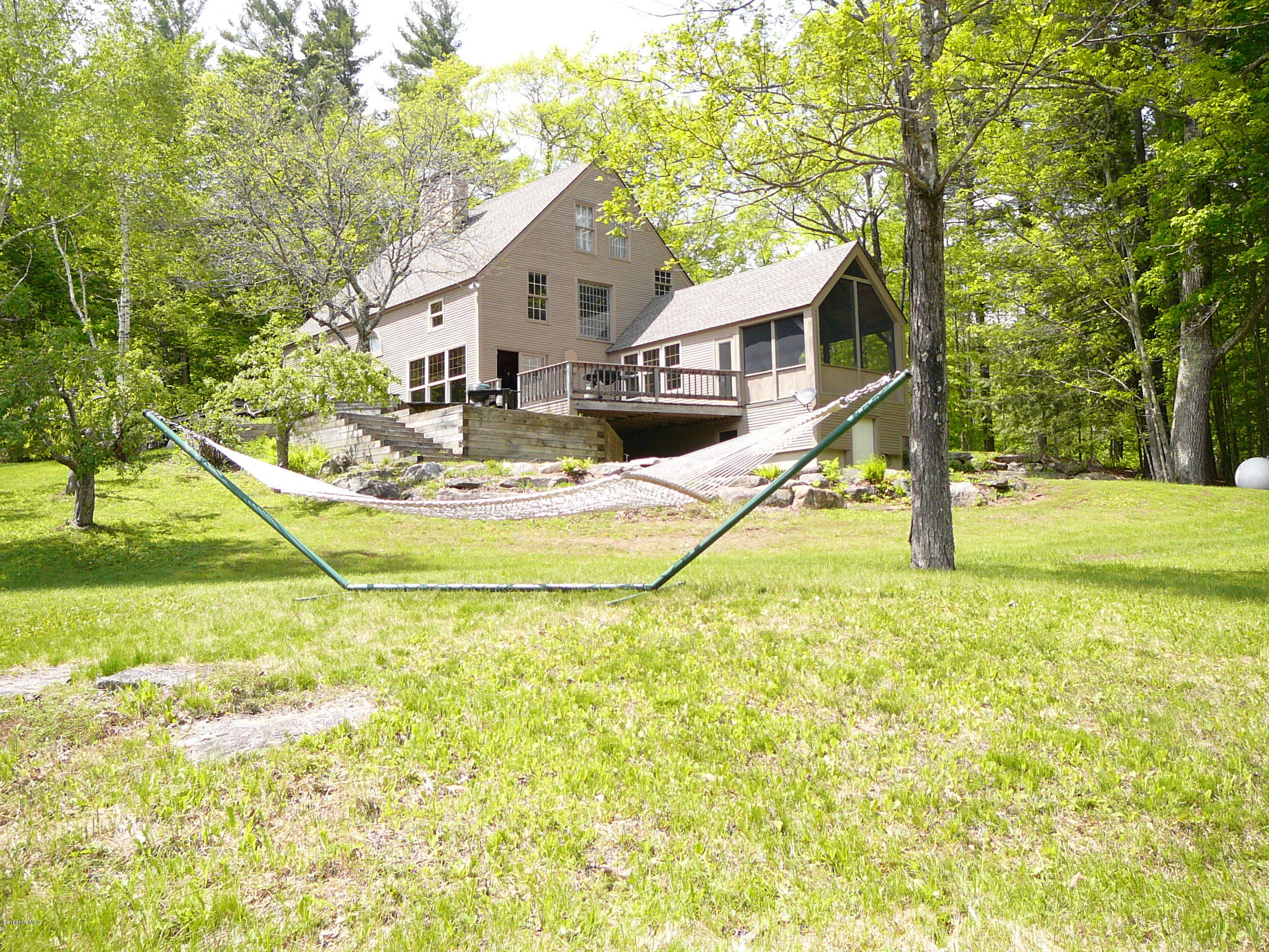 126 Tyringham Road Monterey, MA 01245 - Photo 19 of 35 a view of a house with swimming pool and sitting area