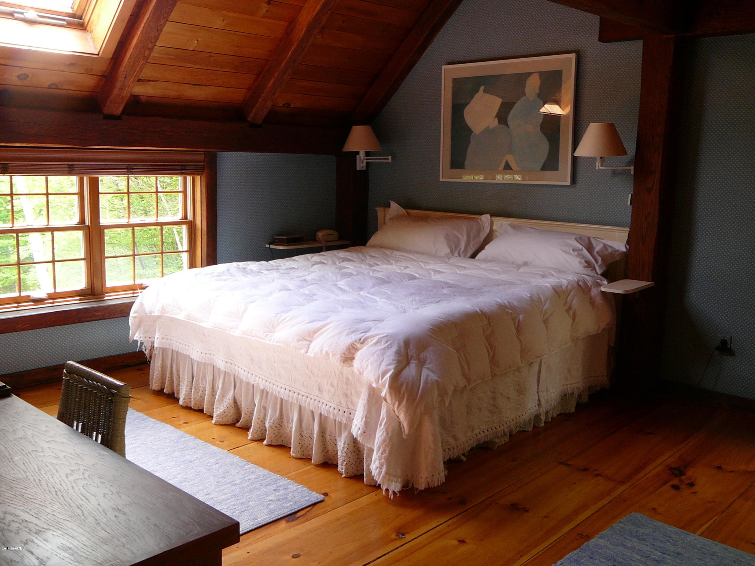 126 Tyringham Road Monterey, MA 01245 - Photo 24 of 35 a bedroom with a bed and wooden floor