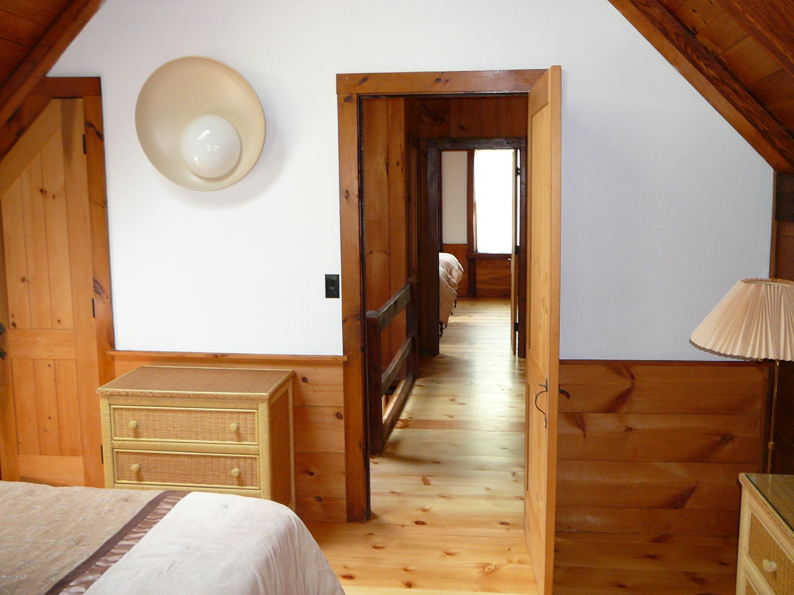 126 Tyringham Road Monterey, MA 01245 - Photo 28 of 35 a bedroom with a bed and cabinets