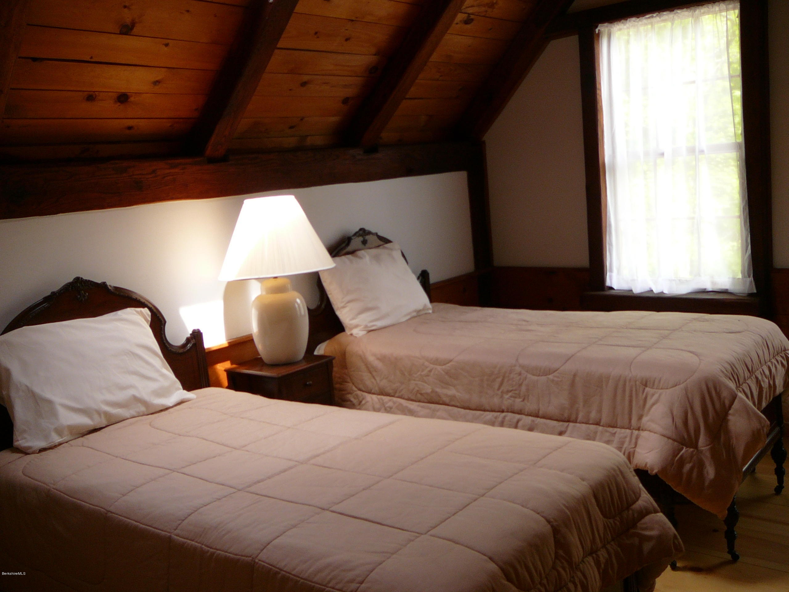 126 Tyringham Road Monterey, MA 01245 - Photo 29 of 35 a bedroom with two beds and a large window