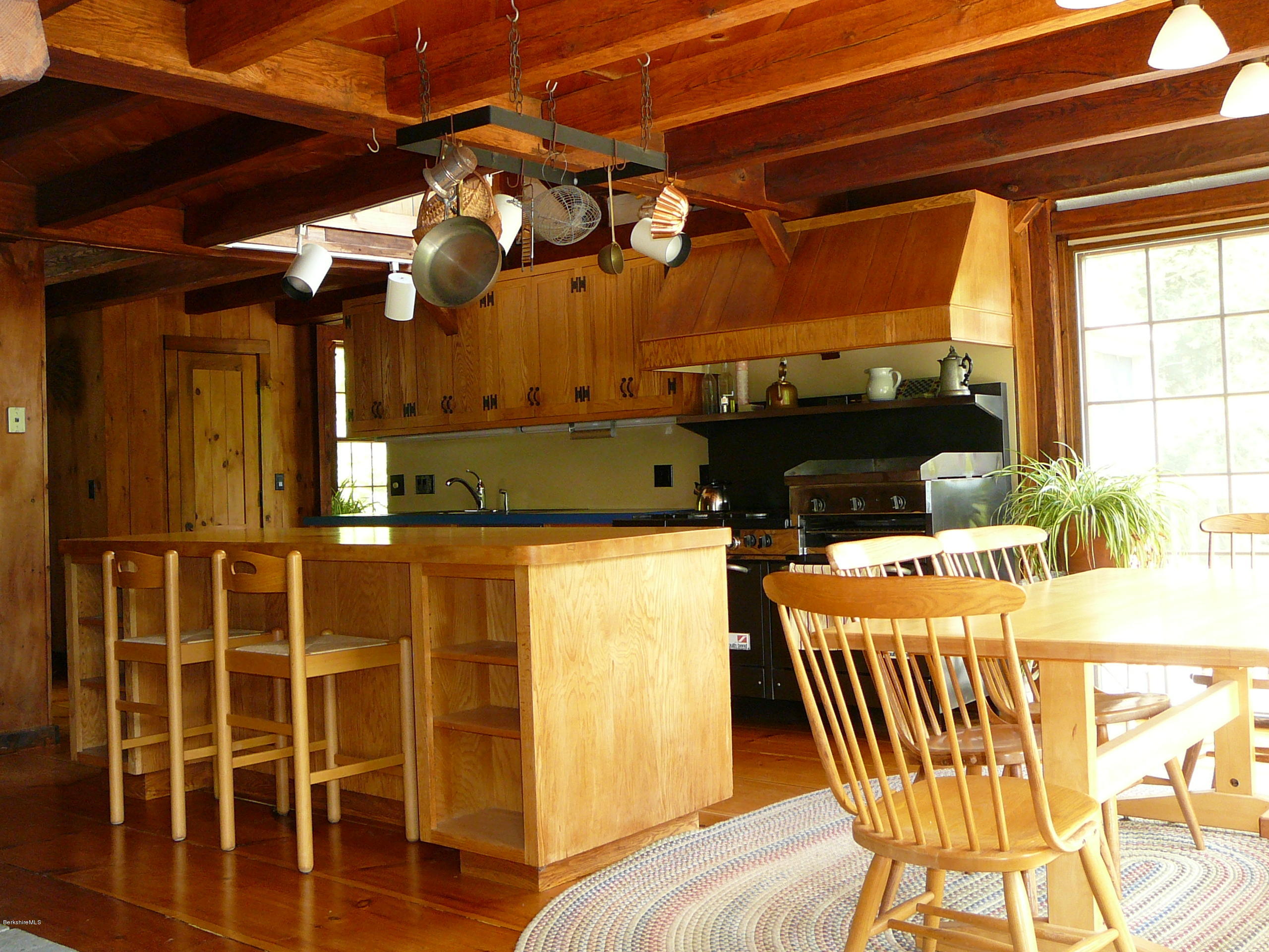 126 Tyringham Road Monterey, MA 01245 - Photo 32 of 35 a view of a patio with table and chairs