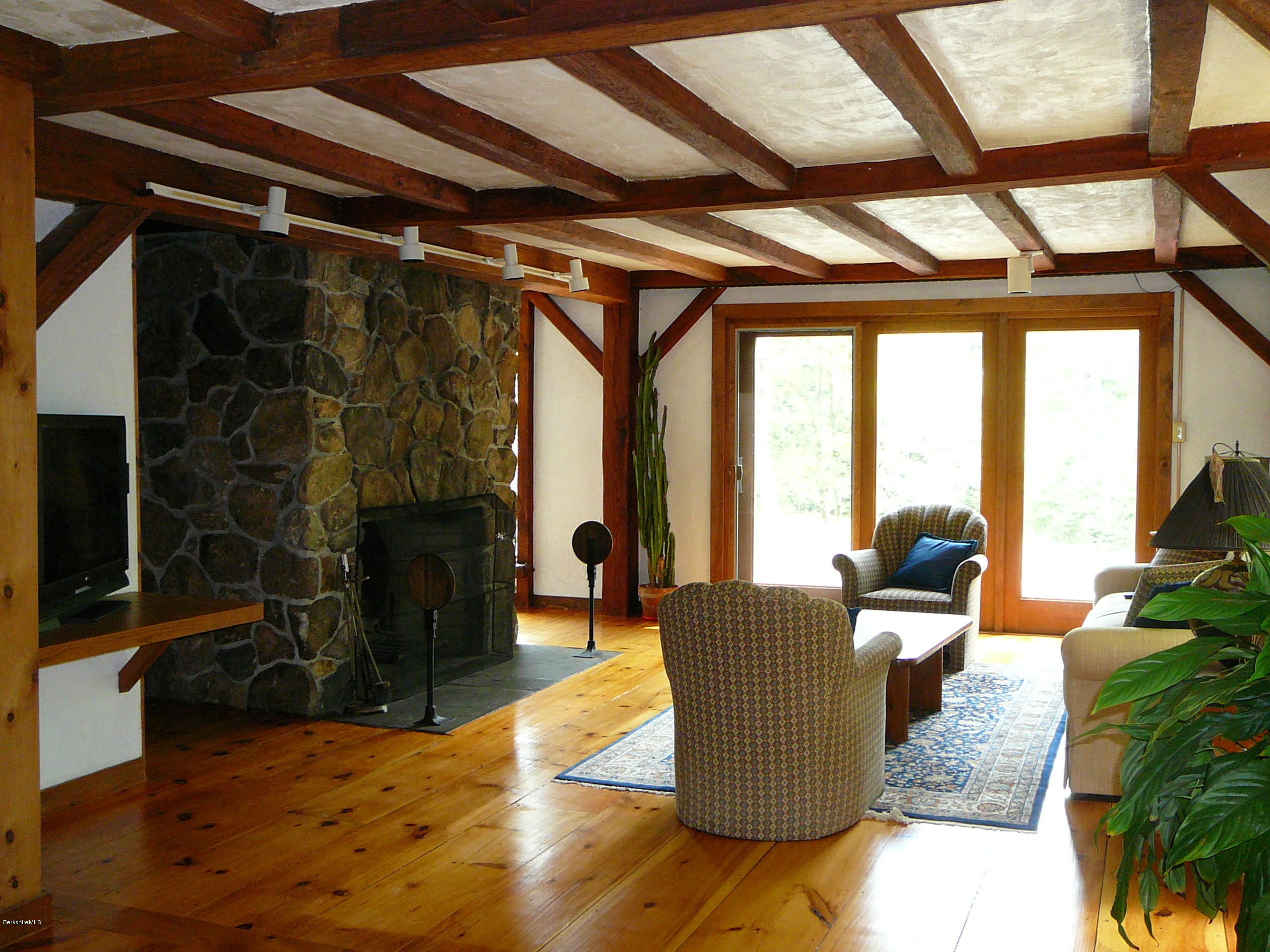 126 Tyringham Road Monterey, MA 01245 - Photo 33 of 35 a living room with furniture and a fireplace