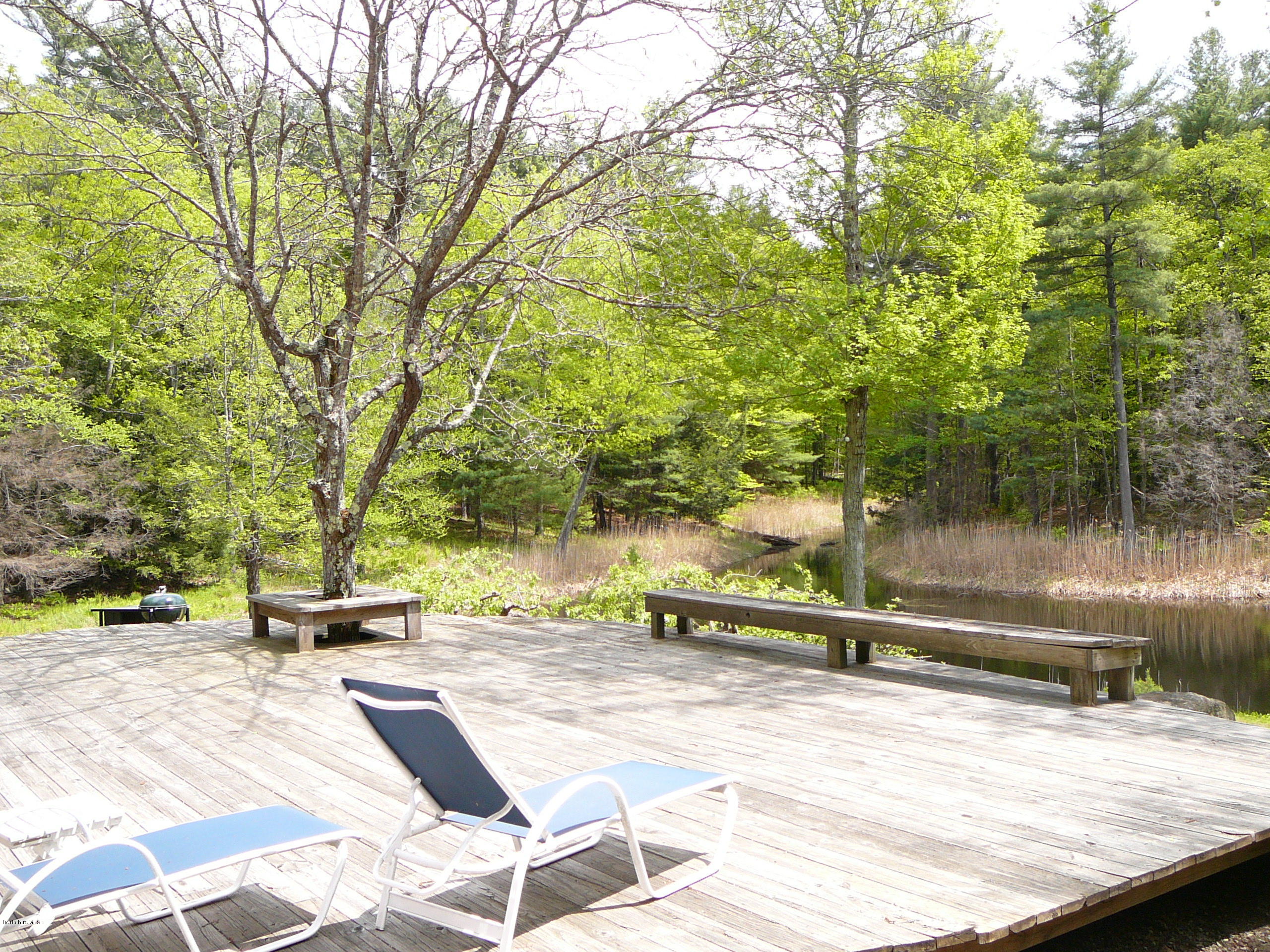 126 Tyringham Road Monterey, MA 01245 - Photo 34 of 35 a view of backyard with a table and chair