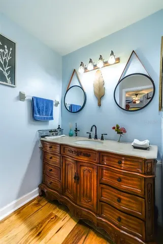 a bathroom with a sink and a mirror