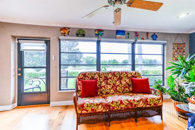 a living room with furniture fireplace and window