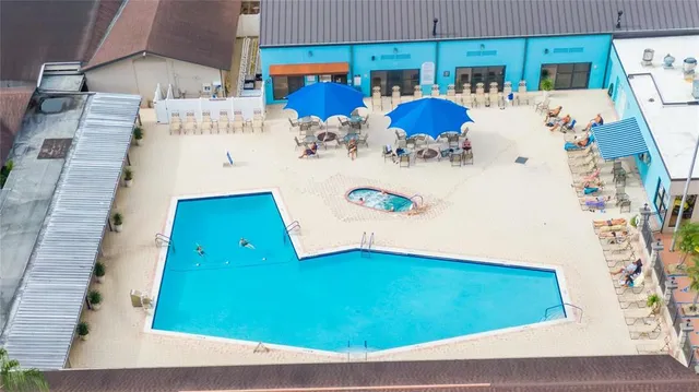 a view of swimming pool with wooden floor