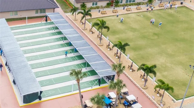 an aerial view of a house with a swimming pool yard and outdoor seating