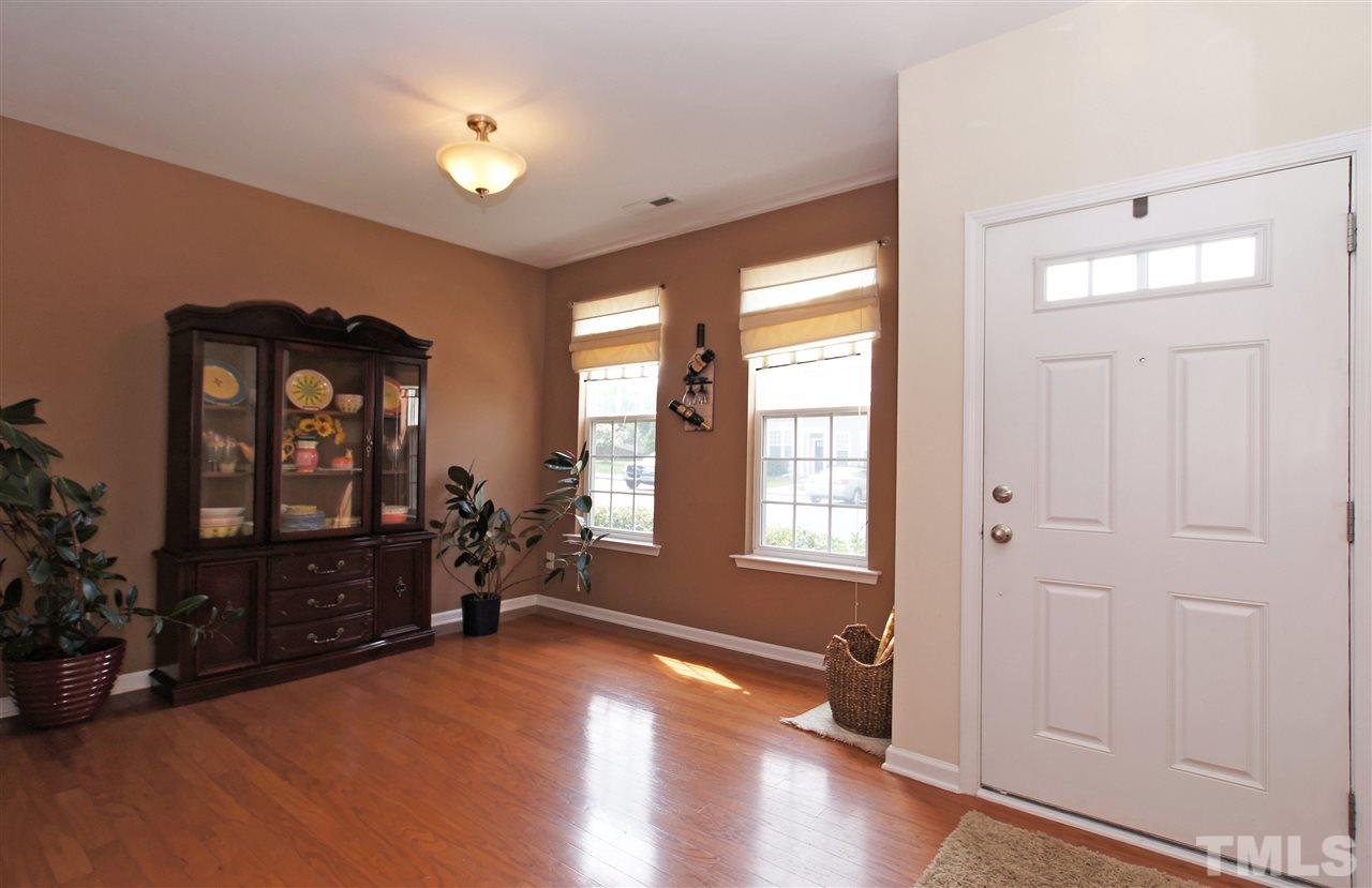 7822 Silverthread Lane Raleigh, NC 27617 - Photo 2 of 18 wooden floor in an empty room with a window