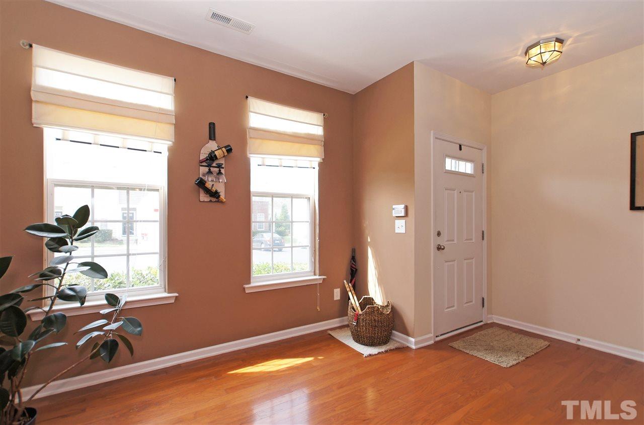 7822 Silverthread Lane Raleigh, NC 27617 - Photo 3 of 18 a view of livingroom with hardwood floor and a window
