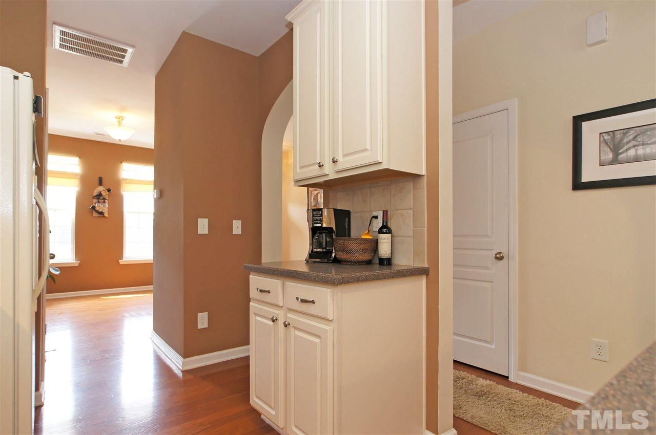 7822 Silverthread Lane Raleigh, NC 27617 - Photo 6 of 18 a kitchen with stainless steel appliances granite countertop a refrigerator and a cabinets