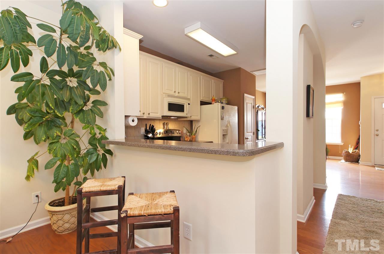 7822 Silverthread Lane Raleigh, NC 27617 - Photo 7 of 18 a view of kitchen with furniture and wooden floor