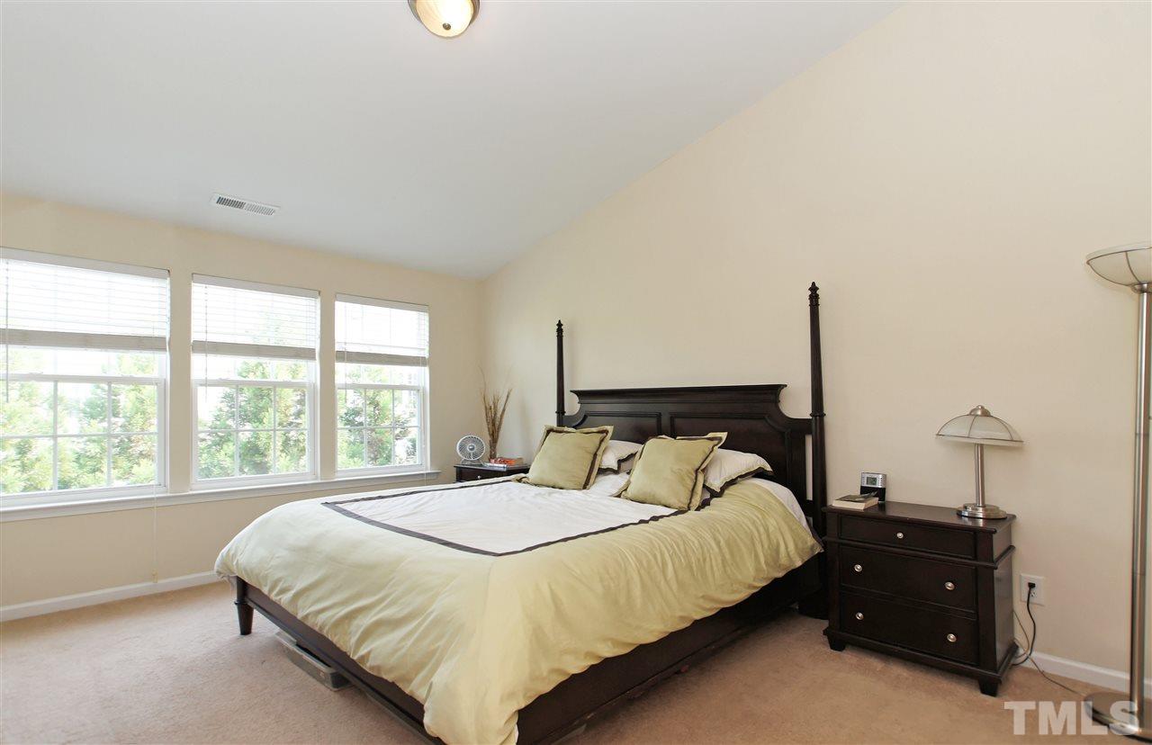 7822 Silverthread Lane Raleigh, NC 27617 - Photo 10 of 18 a bedroom with a bed and window