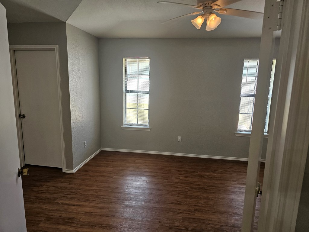 302 Burning Tree Drive Georgetown, TX 78628 - Photo 14 of 30 an empty room with wooden floor and windows