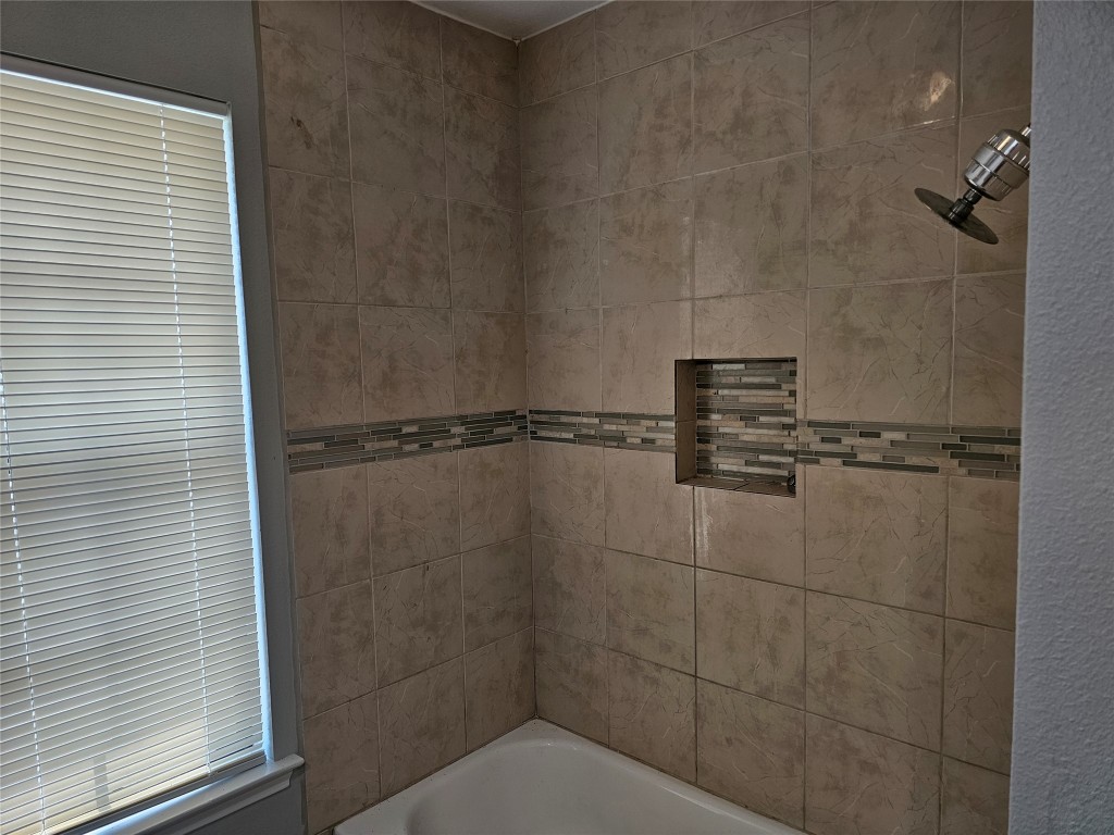 302 Burning Tree Drive Georgetown, TX 78628 - Photo 16 of 30 a bathroom with a shower