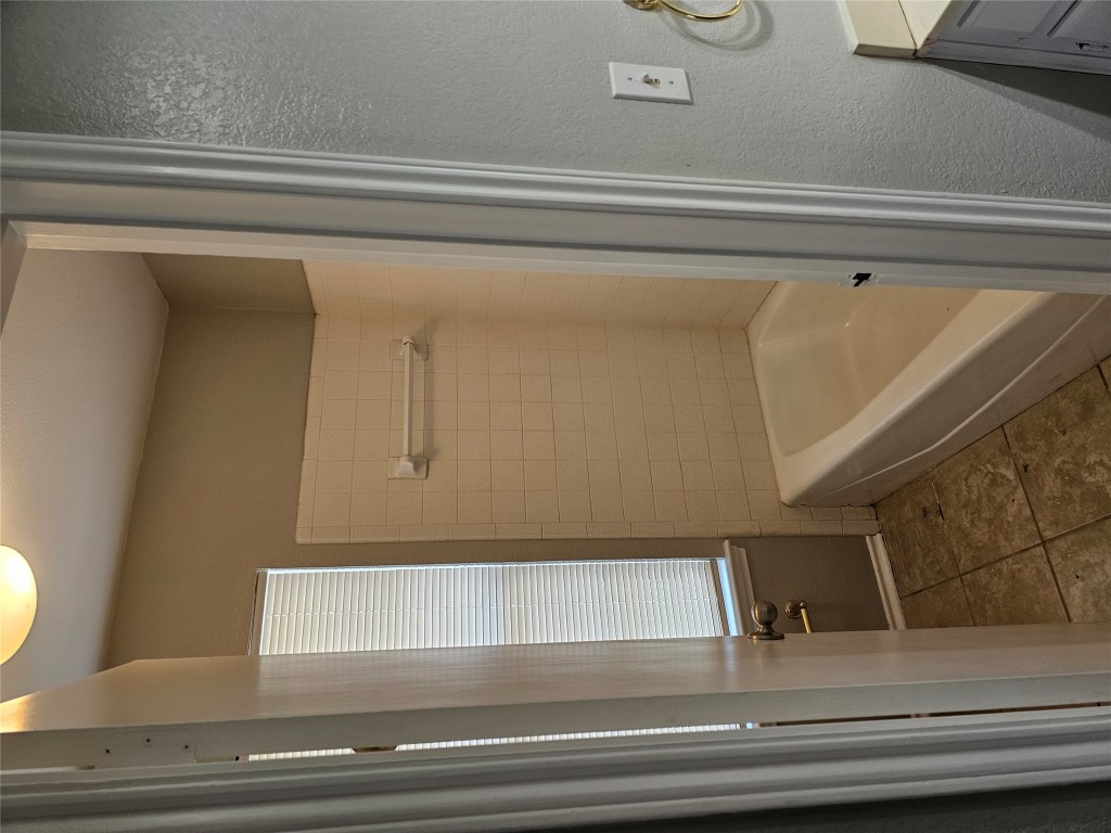 302 Burning Tree Drive Georgetown, TX 78628 - Photo 22 of 30 a bathroom with a tub